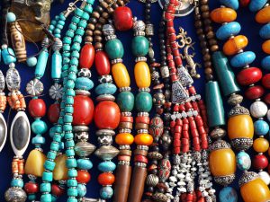 A bunch of colorful street jewelry on a table
